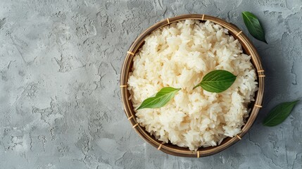 Plate of sticky rice on a gray background