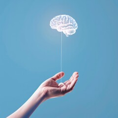 Wall Mural - a transparent brain shape with glow dots and connection line floating above hand on blue background