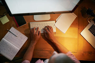 Aufkleber - Hands, computer and typing from above with notebook, remote work and networking at night. Person, keyboard and editing at desk for communication, copywriting and online research or social media