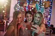 © Bester/peopleimages.com - Women, selfie and smile at nightclub party for memories on weekend for social media with technology. Fashion, makeup and adult easter event with music, dance and new years eve celebration in Germany.