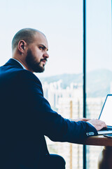 Fototapete - skilled confident male entrepreneur dressed in formal apparel thinking on developing own business pr