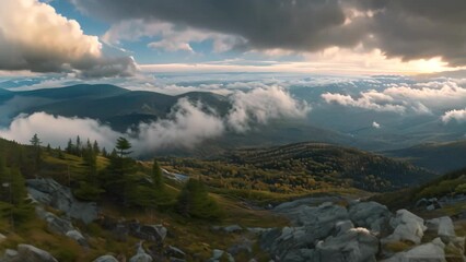 Poster - View of clouds and mountain peaks from atop a majestic mountain, A panoramic view from a mountaintop with clouds rolling in over the horizon