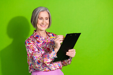 Poster - Photo of charming attractive lady wear pink blouse signing contract empty space isolated green color background