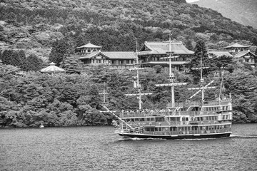 Wall Mural - Hakone, Japan - May 24, 2016: Mountain Fuji and Lake Ashi with Hakone sightseeing boat in spring season