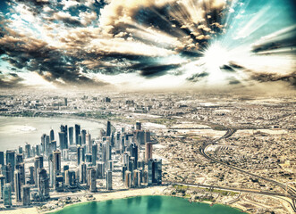 Poster - Aerial view of Doha skyline from airplane. Corniche and modern buildings, Qatar