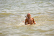 © Наталія Богодіца - joyful boy swimming in the sea, splashing, drops of water, calm, summer, rest, sun, vacation, ocean, enjoyment