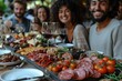© SHI - Happy friends sitting at restaurant tables drinking red wine - multi-racial young people enjoying a rooftop dinner party together - food and drink concepts, tourism concepts