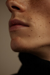 Poster - Macro shot of a small mole on a personâ€™s collarbone, highlighting the natural skin tones and texture,