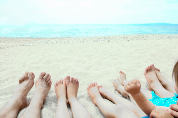 Wall Mural - beautiful legs in the sand of the sea greece background