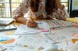 © Nognapas - Businesswoman working with documents analyzing business and planning financial accounting.