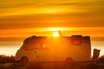 Poster - Caravan on sea at sunrise.