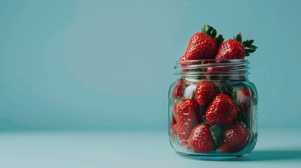 Wall Mural - Close up image of fresh strawberries in a transparent jar with room for text
