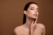 © Beauty Hero - Photo of dreamy pretty lady naked shoulders applying cream empty space isolated brown color background