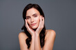 © Beauty Hero - Portrait of brunette hair woman touch cheeks face soft skin isolated grey color background