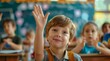 © top images - Children raise their hands to answer in the classroom. Back To School concept. Backdrop with selective focus