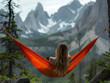 © Anna - a woman sits in a hammock and enjoys the mountain landscape