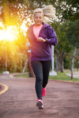 Wall Mural - fitness woman training and jogging in summer park. healthy lifestyle and sport