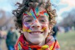 © ChaoticMind - A happy child shows off vibrant face paint in a colorful outdoor setting
