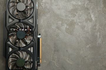Poster - One graphics card on grey table, top view. Space for text