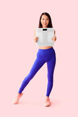 Sticker - Beautiful young Asian woman with scales on pink background. Weight loss concept