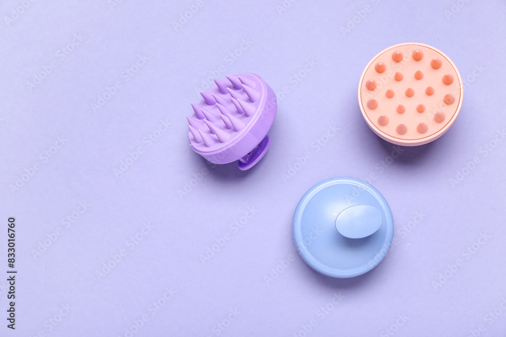 Hair scalp massagers on purple background