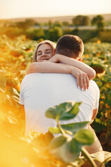 Wall Mural - People spend time in a sunflowers field