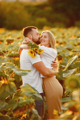 Wall Mural - People spend time in a sunflowers field