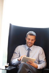 Aufkleber - Business, man and happy in armchair with tablet, relax and office for stock market research for networking. Communication, information and smile for good news, online shares and virtual investor
