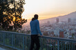 © Анна Степанова - Guy looking at the sunset, enjoy beautiful city view, traveler mock up top of the city