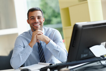 Aufkleber - Businessman, happy and portrait with computer at desk for work research, online connection and communication. Smile, male person or account manager with pc and documents on table for company report