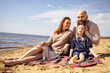 © DariaTrofimova - Sunny portrait of  loving family of parents and daughter with son on  beach by  sea