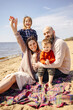 © DariaTrofimova - Portrait of  loving family of parents and daughter with son on  beach by   sea