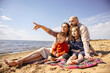 © DariaTrofimova - Sunny portrait of  loving family of parents and daughter with son on  beach by  sea