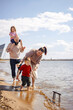© DariaTrofimova - Portrait of a family of four on the beach in spring