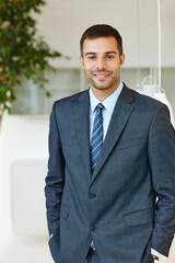 Poster - Corporate, portrait and suit with business man at office for start of professional career as intern. Company, confident and happy with smile of formal employee in workplace for administration