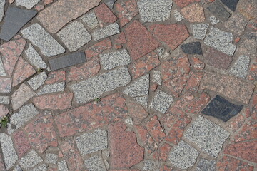 Sticker - Top view of crazy pavement made of multicolored polished granite stone blocks