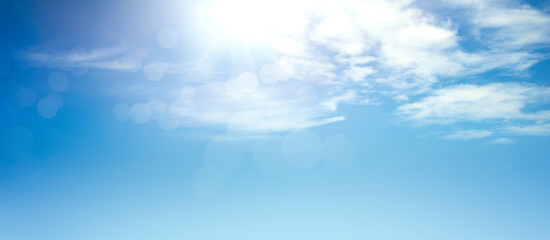 Wall Mural - a bright fresh sunny spring, summer blue sky background with white fluffy clouds.