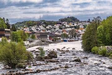 Canvas Print - River with a lot of rocks running wild through Egersund in Norway