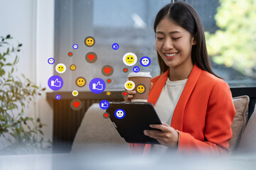 Wall Mural - Social media icons screen of businesswoman with smartphone and laptop computer at office at morning light.