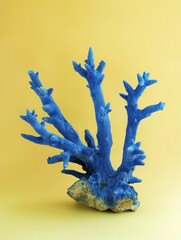 Wall Mural - blue corals on a light yellow background.