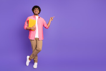 Wall Mural - Full size photo of nice young man hold book point finger empty space wear shirt isolated on violet color background