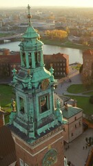 Wall Mural - Towers and inner yard of the Historic royal Wawel castle in Cracow at sunset, Poland. Aerial view of the Royal Wawel Castle and Vistula river in autumn.