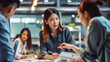 © Graphic Master - Chinese corporate woman discussing a project