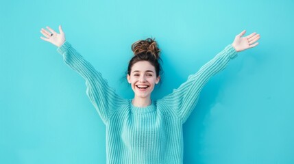 Wall Mural - The happy woman in blue sweater