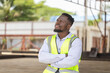 © JU.STOCKER - Engineer man takes a break in the precast factory site, Factory worker man in hardhat with crossed arms