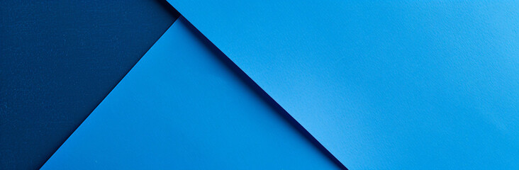 Poster - a blue background with an empty paper for copy space. 
