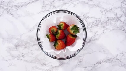 Wall Mural - Washed and Dried Strawberries Stored Safely in a Glass Bowl