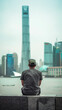 © lutjo1953 - Young Man and the City.  Generated image.  A digital rendering of a young man in a cap and T-shirt sits on a concrete wall overlooking a skyscraper with a clear sky.