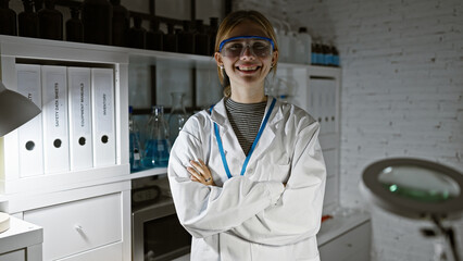 Poster - A confident woman scientist crossing arms stands indoors at a laboratory, beaming with professionalism and intelligence.