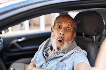 Poster - Senior man's amazed face in disbelief, mouth open in surprise as he makes a scared car selfie